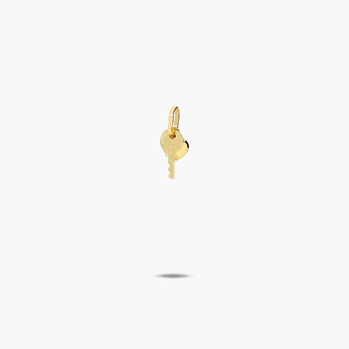 Colgante corazon y llave de oro 18K 10 mm