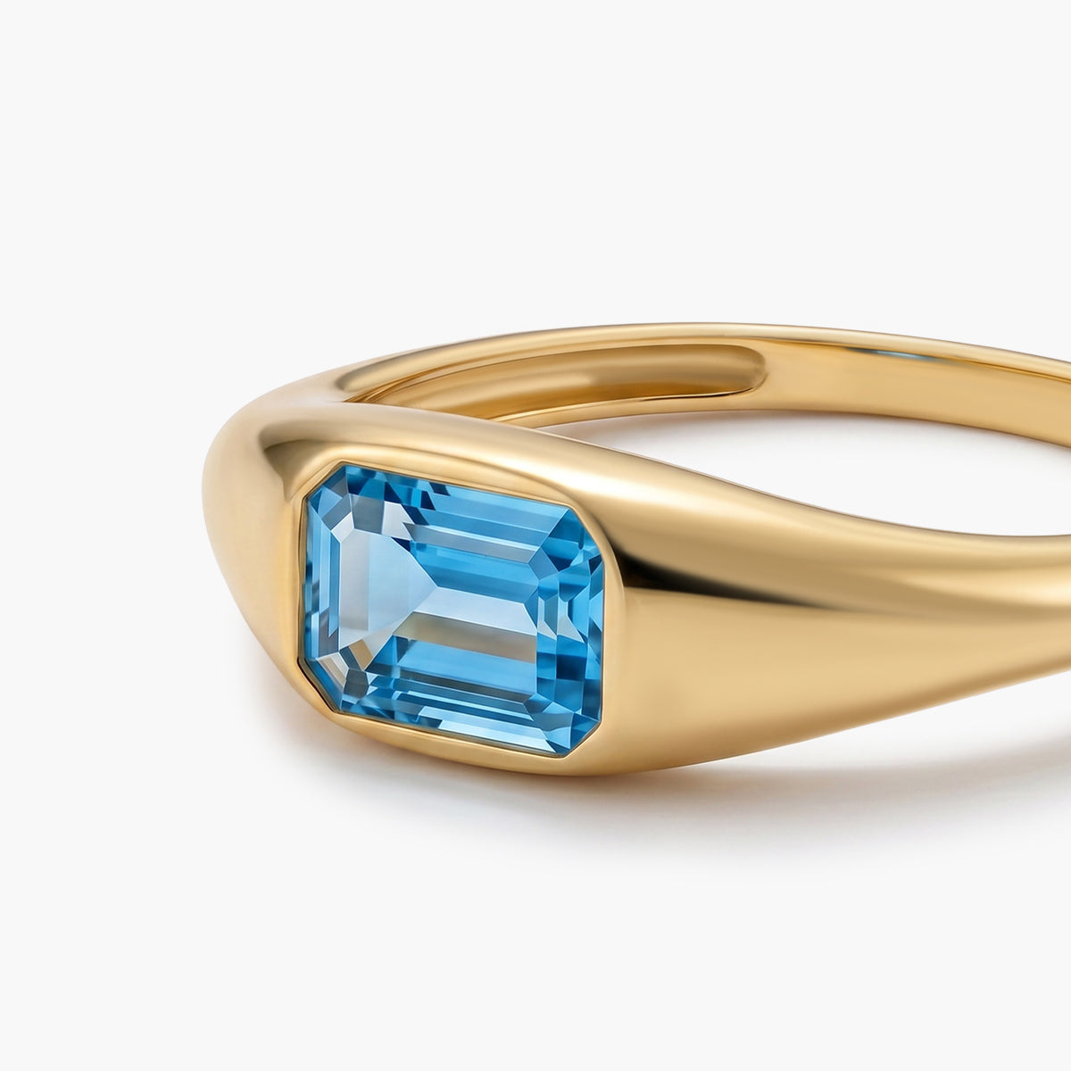 Anillo de plata 1ª ley con baño de oro 18K topacio azul BLOWN