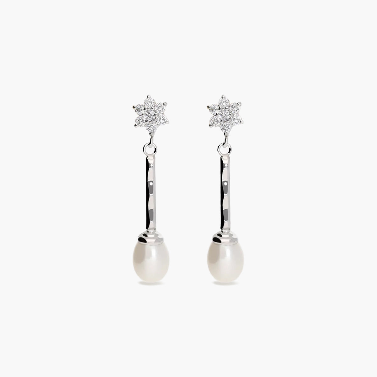 Pendientes largos estrellas de oro blanco 18K con perlas y circonitas 33 mm