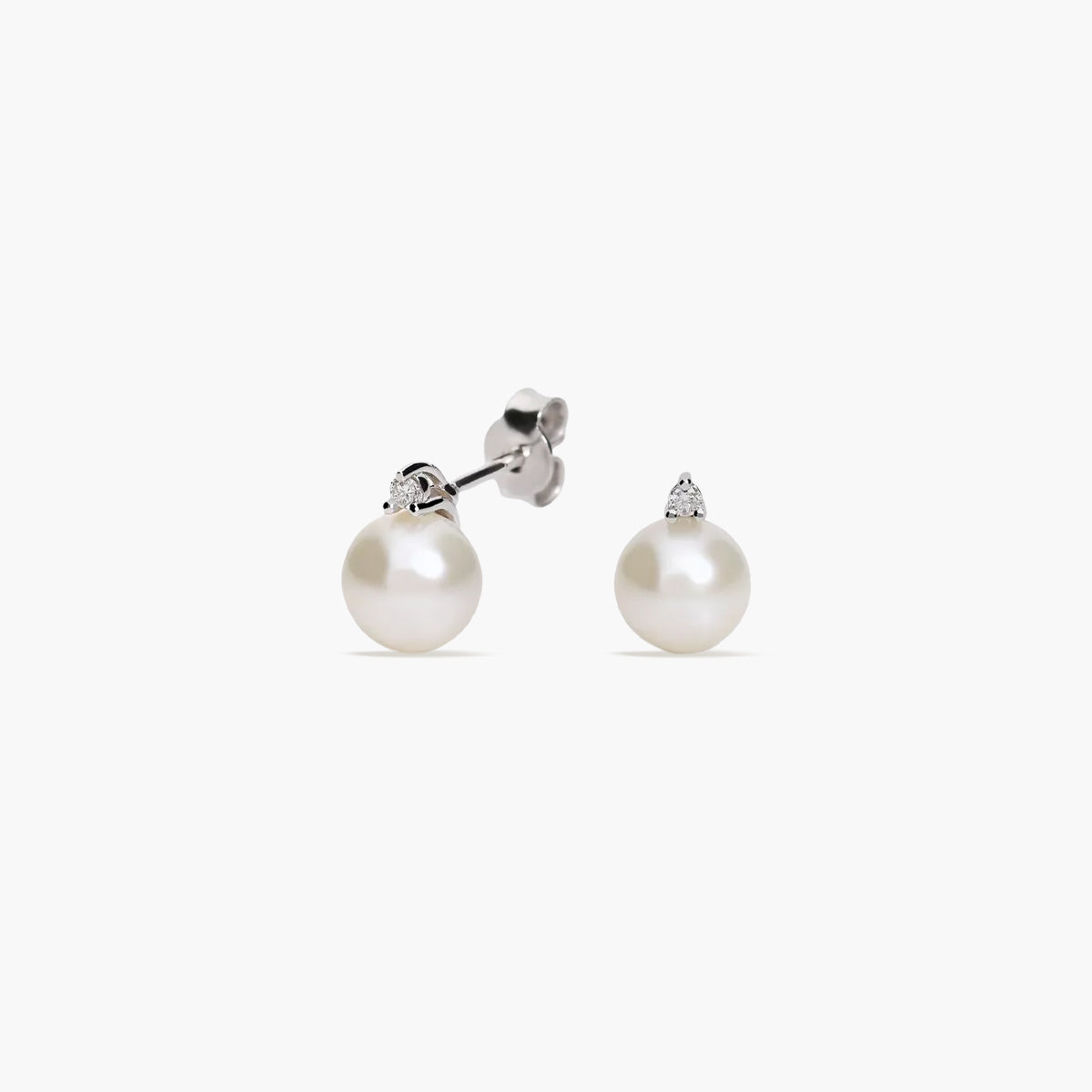 Pendientes de oro blanco 18K diamante natural 0.04 ct. con perlas 7 mm