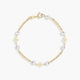 Pulsera infantil de oro 18K con perlas y motivos de flor 13 cm