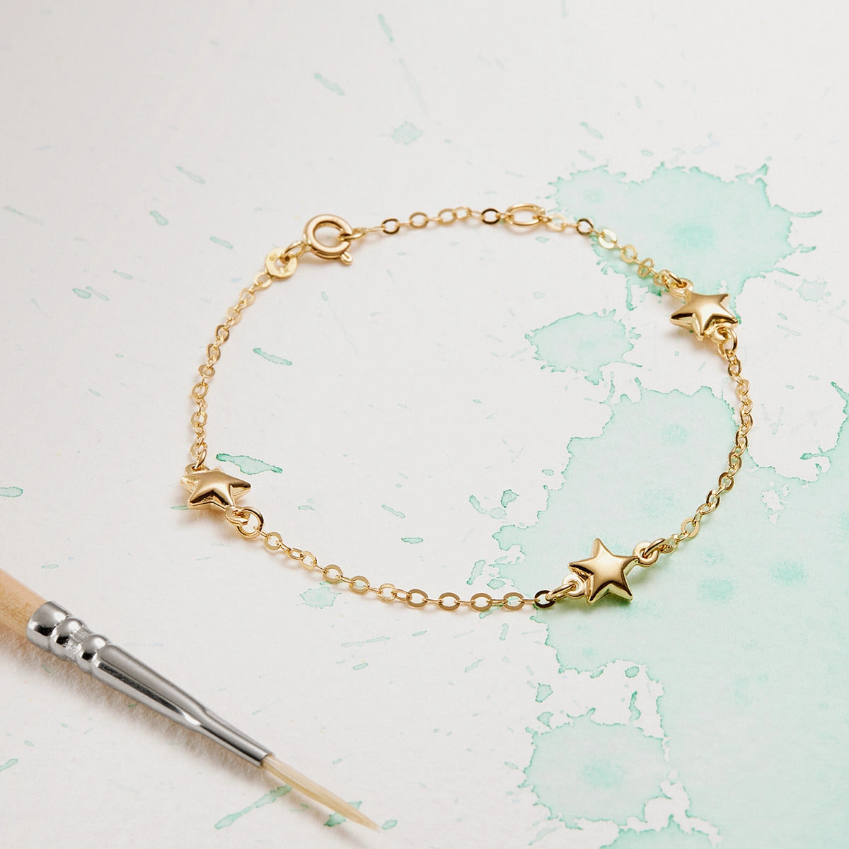 Pulsera infantil de oro 18K estrellas 15-17 cm