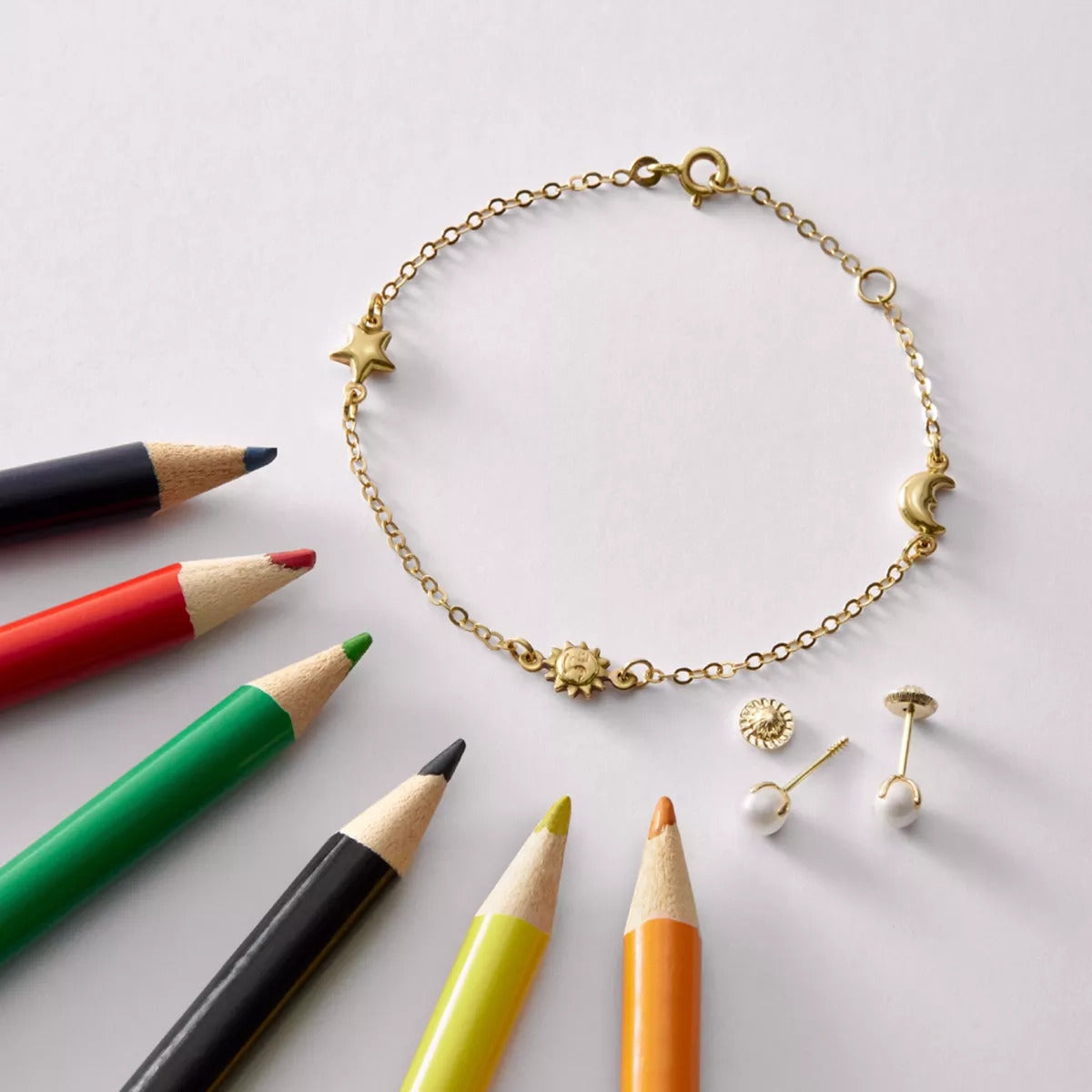 Pulsera infantil de oro 18K con motivos de estrella, sol y luna 15-17 cm