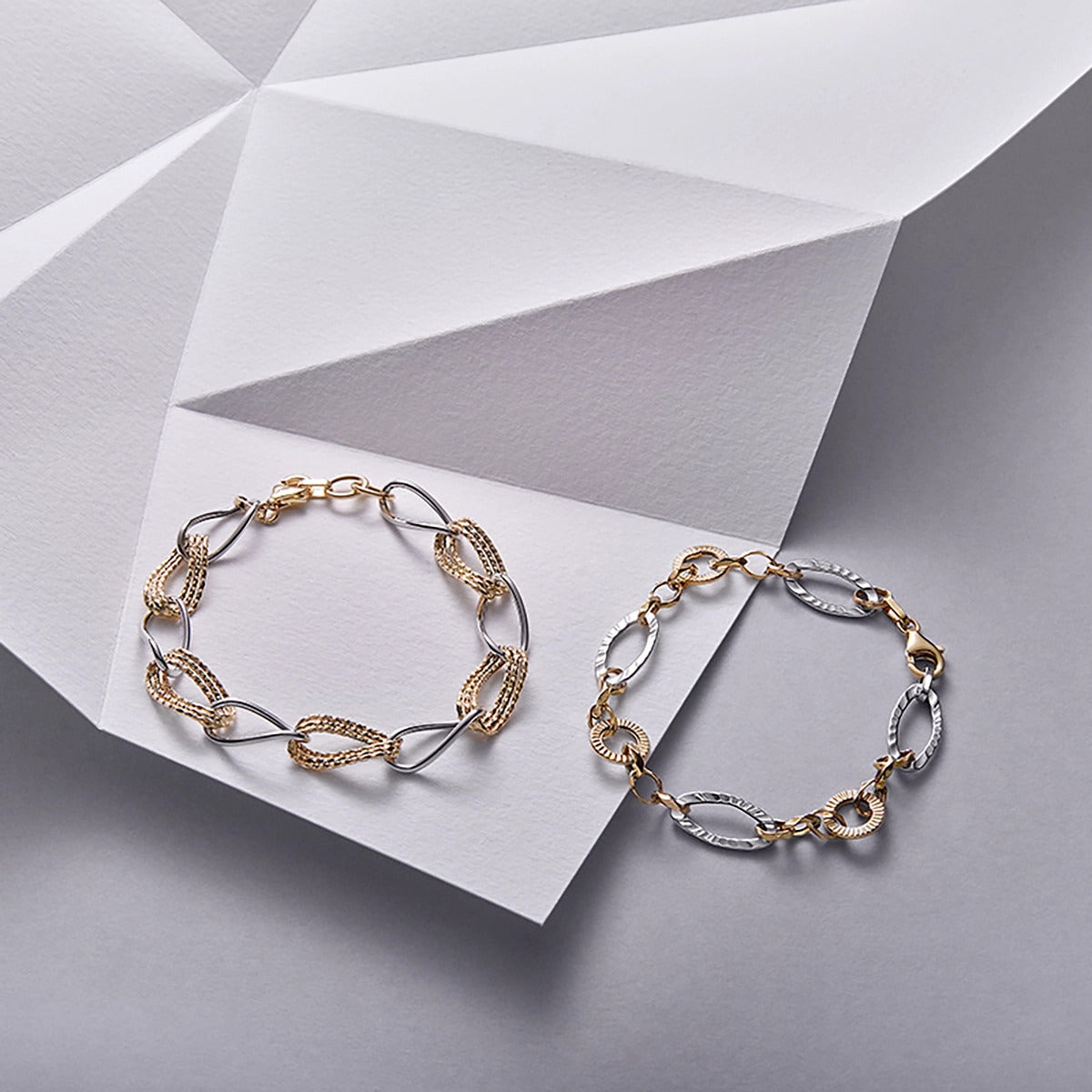 Pulsera de oro bicolor 18K eslabón anillas triple oval 19 cm