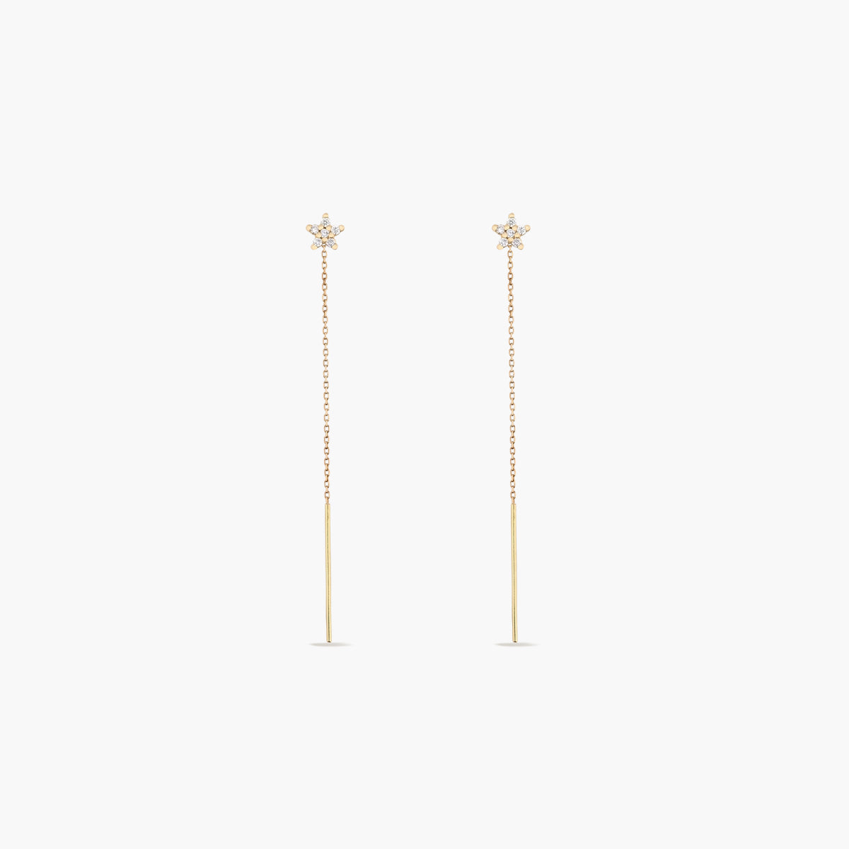 Pendientes largos estrella de oro 18K diamante natural 0.13 ct. 60 mm