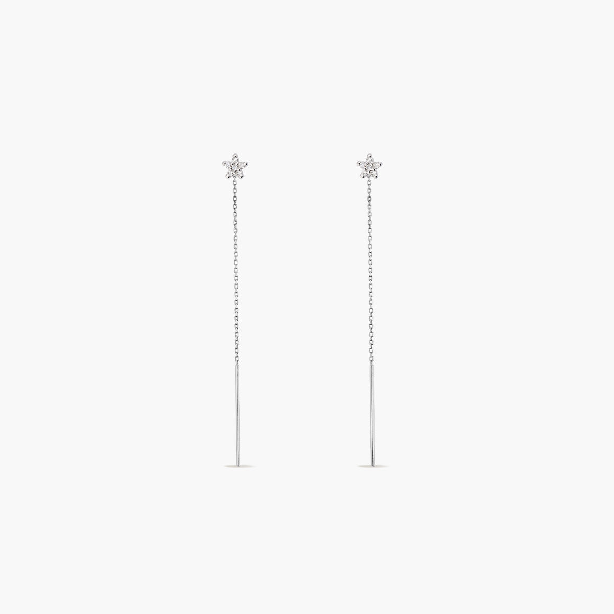 Pendientes largos estrella de oro blanco 18K diamante natural 0.13 ct. 60 mm