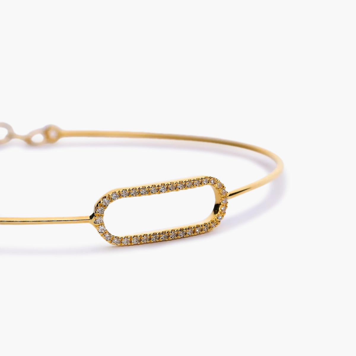 Pulsera rígida oval calado de oro 18K diamante natural 0.09 ct. 55x47 mm
