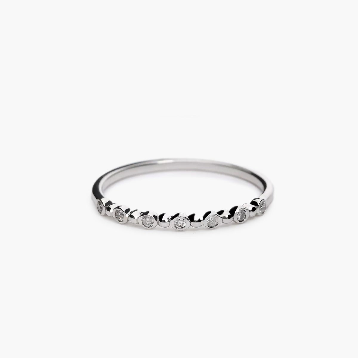 Anillo de oro blanco 18K diamante natural 0.07 ct.