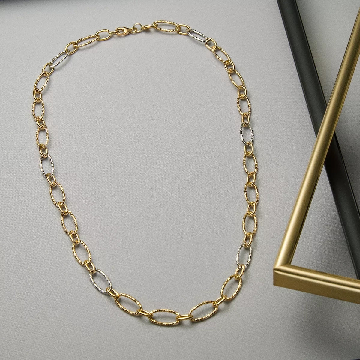 Gargantilla de oro bicolor 18K 45 cm anillas