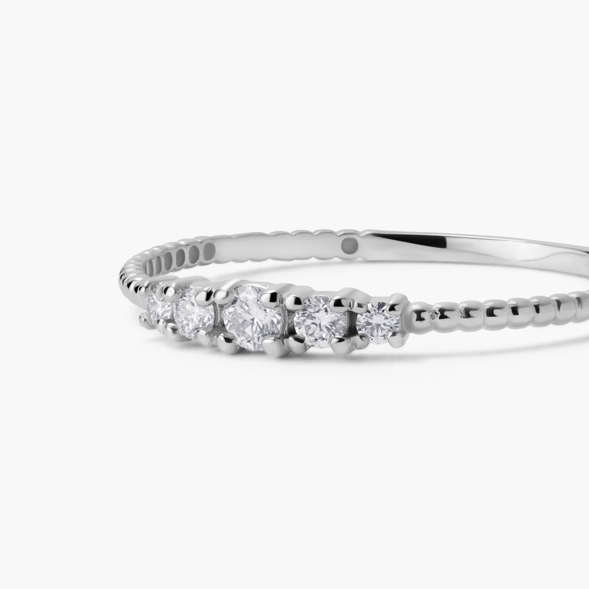 Anillo de oro blanco 18K diamante natural 0.13 ct. 