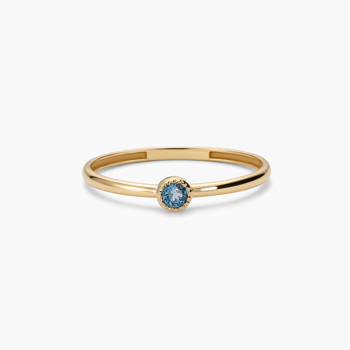 Anillo de oro 18K topacio azul 2 mm