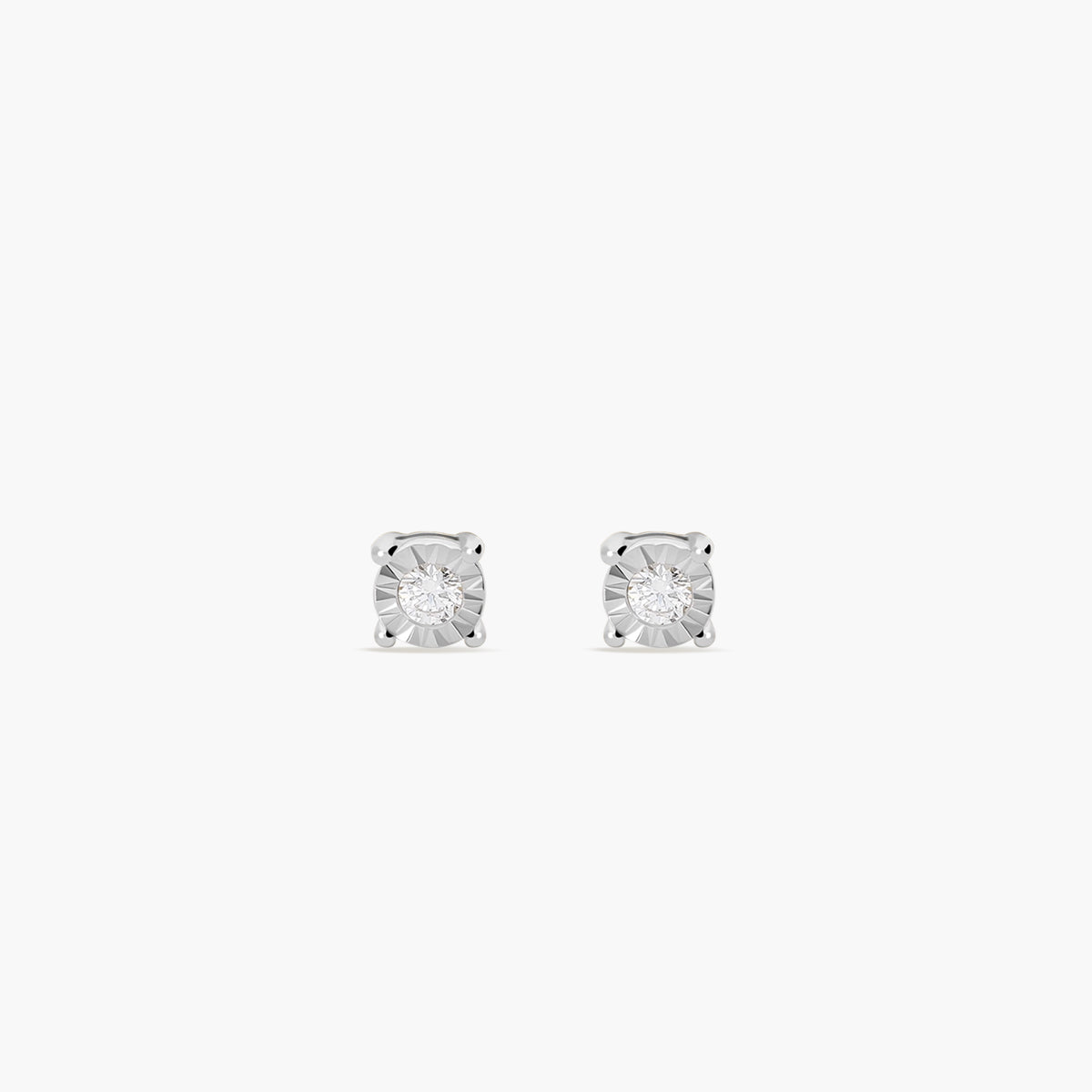 Pendientes redondos de oro blanco 18K diamante natural 0.06 ct. 3 mm
