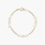 Pulsera infantil de oro 18K con perlas y motivos de flor 13 cm