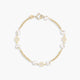 Pulsera infantil de oro 18K con perlas y motivos de flor 13 cm
