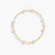 Pulsera infantil de oro 18K con perlas y motivos de flor 17 cm