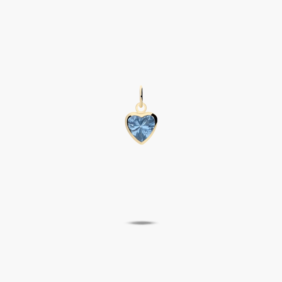 Colgante corazón de oro 18K circonita azul 7mm