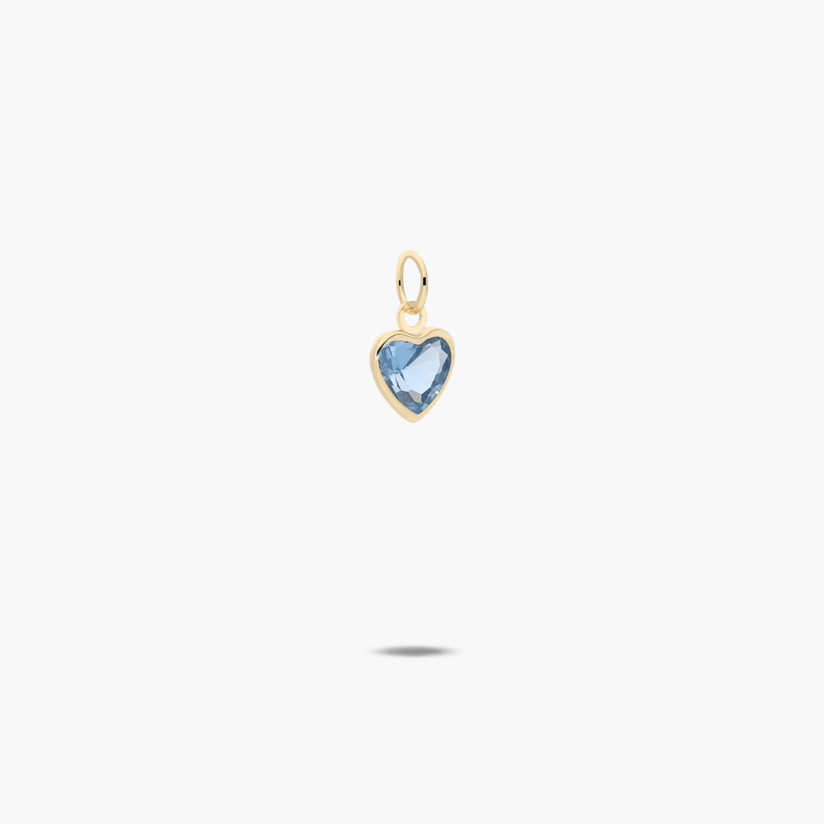 Colgante corazón de oro 18K circonita azul 7mm