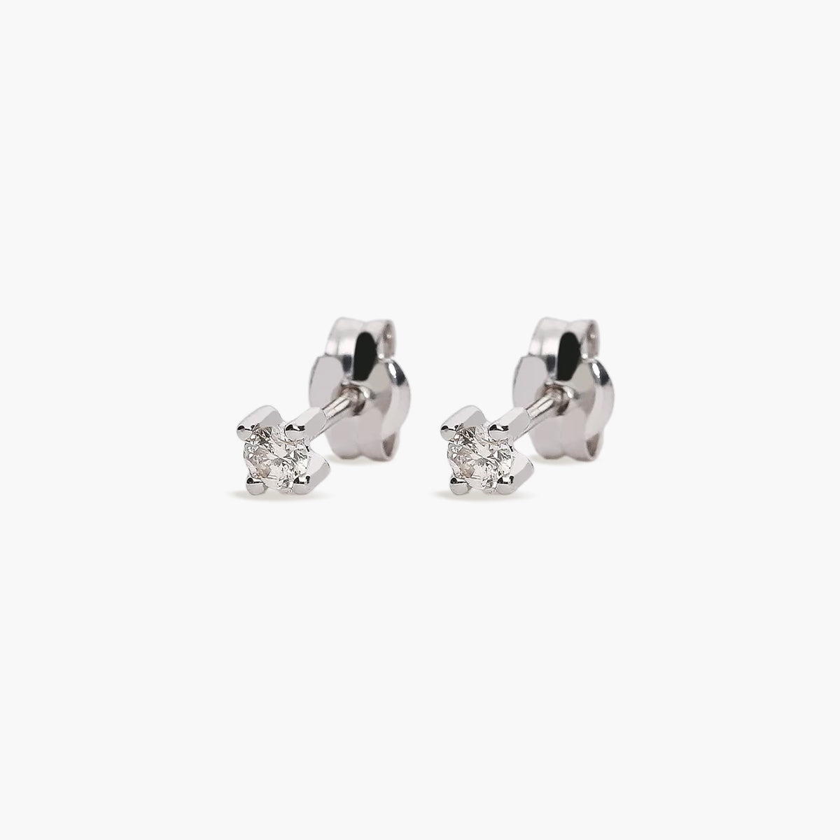 Pendientes redondos de oro blanco 18K diamante natural 0.05 ct. 2 mm