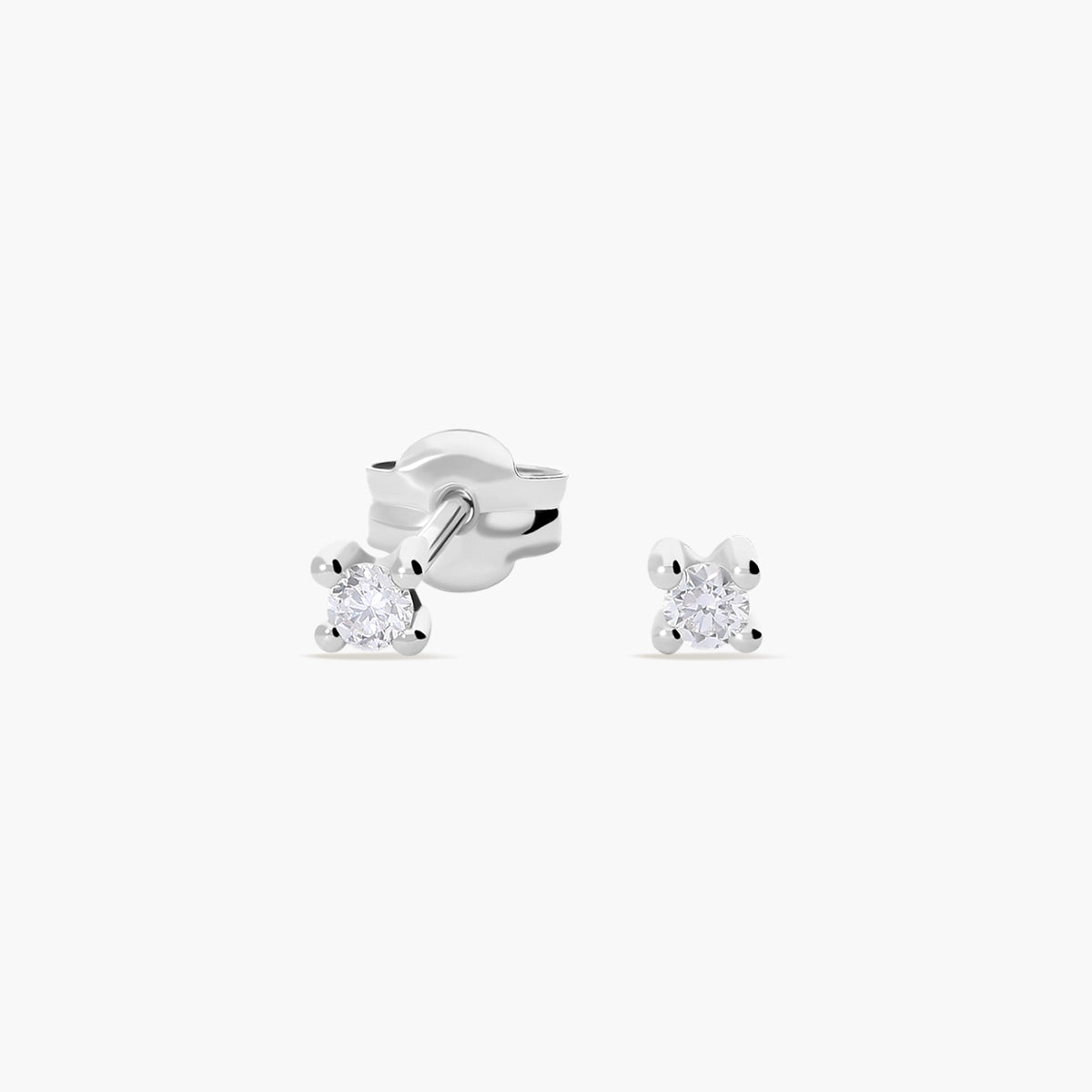 Pendientes redondos de oro blanco 18K diamante natural 0.10 ct. 2 mm