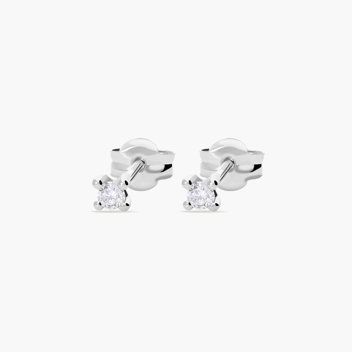 Pendientes redondos de oro blanco 18K diamante natural 0.10 ct. 2 mm